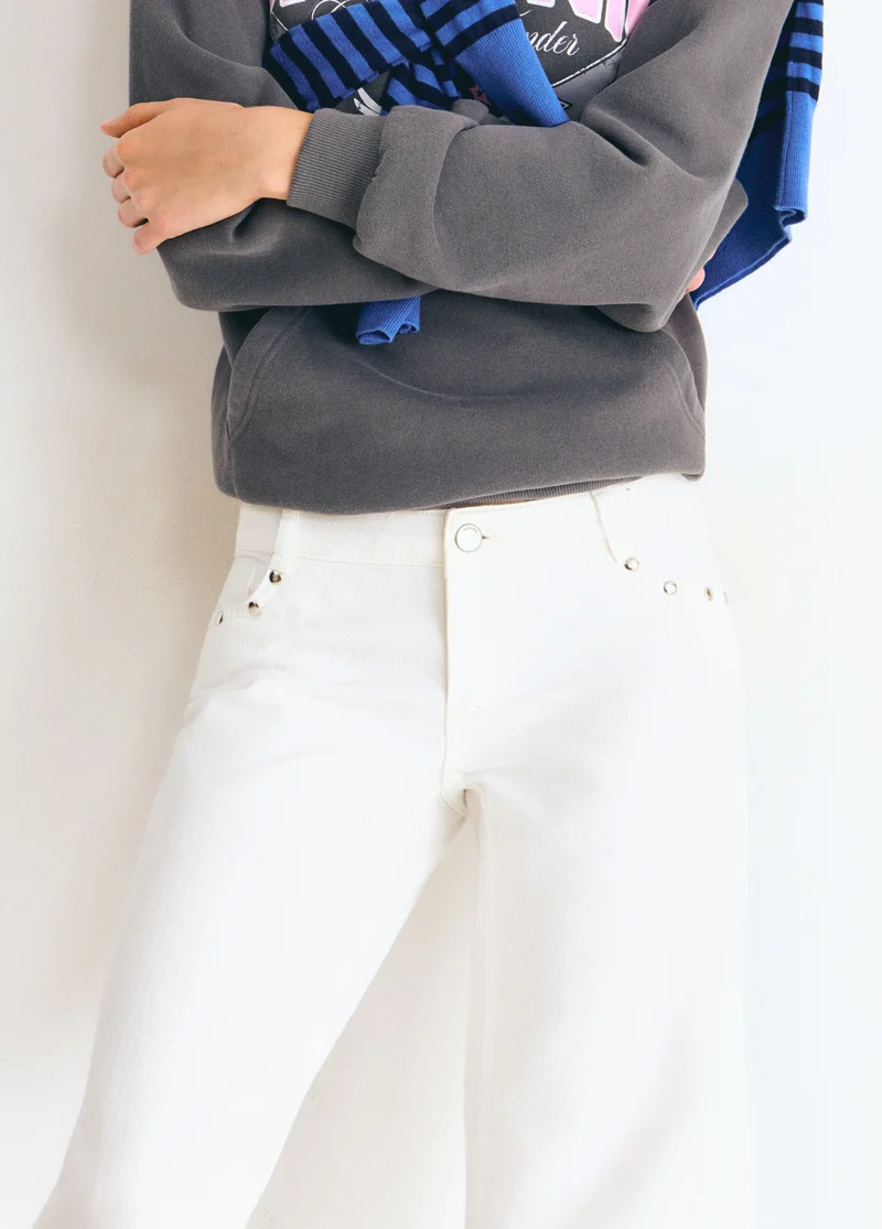 Low-rise pants with glitter stars and studs