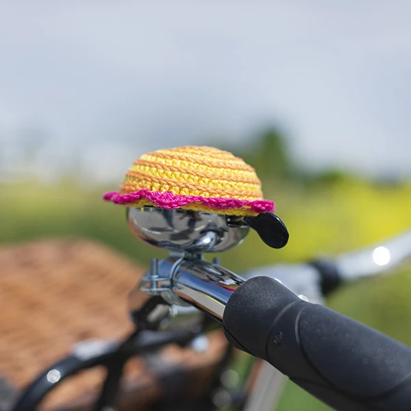 Häkelanleitung für eine Hülle für eine Fahrradklingel mit Blumenmotiv